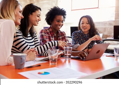 Group Of Female Designers Having Meeting In Modern Office