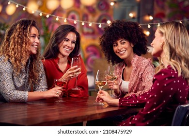 Group Of Female Friends Enjoying Party Night Out In Bar