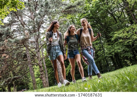 Similar – Frauenfreunde lachend bei Spaziergängen im Wald