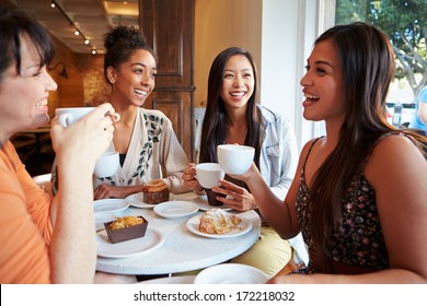 Group Of Female Friends Meeting In Cafe Restaurant