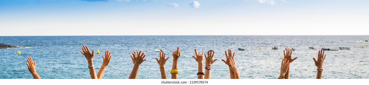 group of female hands in panoramic style with ocean in background, colors and vacation concept. happiness for group of young people in the summer time. joyful and outdoor leisure lifestyle people. - Powered by Shutterstock