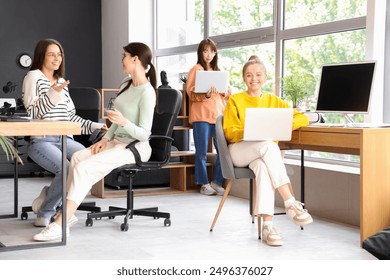 Group of female programmers working in office