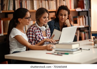 Group of  female students study in the school  library.Learning and preparing for university exam. - Shutterstock ID 701465644