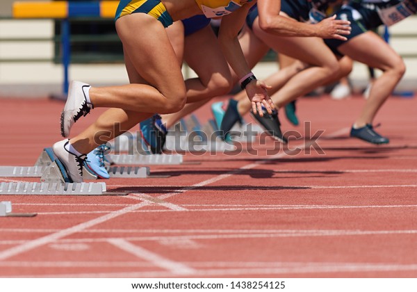 pic from front of female in track starting blocks