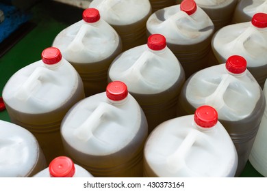 Group Of Filled With Olive Oil Plastic Containers 