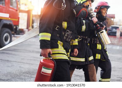 Group Of Firefighters In Protective Uniform That Is On Station.