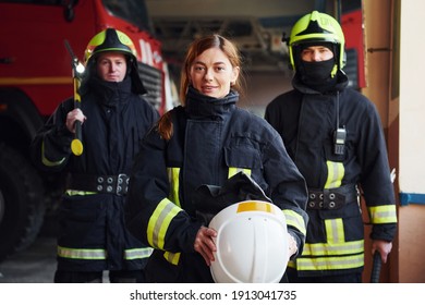 Group Of Firefighters In Protective Uniform That Is On Station.