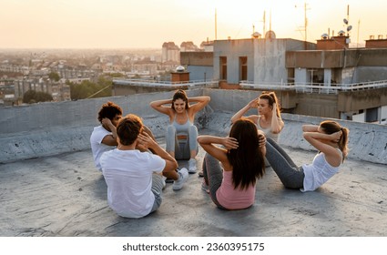 Group of fit healthy friends, people exercising together outdoor - Powered by Shutterstock