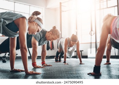 Group, fitness class and exercise with push ups in gym for arm strength, healthy body and wellness. Training collaboration, people and muscle challenge for core, weightloss and physical activity - Powered by Shutterstock