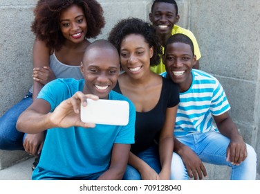 Group Of Five African American Men And Woman Taking Selfie