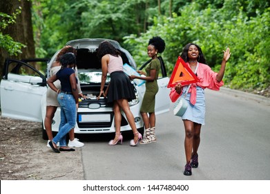 Group Of Five African American Traveler Girls Looking At Broken Car Open Hood.