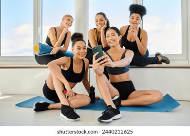 group of five and cheerful interracial female friends in sportswear taking selfie after yoga class - Powered by Shutterstock