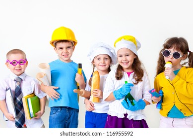 Group Of Five Children Dressing Up As Professions