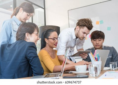 Group Of Five Creative Worker Brainstorm In Office, Sharing Idea With Happy Environment