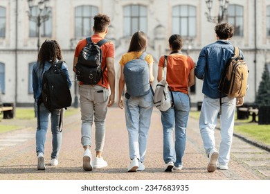 Group of five students with backpacks walking at university campus together, rear view of multiethnic young people going to classes, diverse college friends spending time outdoors after lessons - Shutterstock ID 2347683935