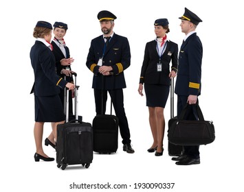 Group of flight attendants and airliner pilots with their travel luggage standing and talking isolated on white background - Powered by Shutterstock