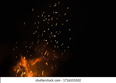 Group of flying sparks in the black background