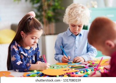 Group Of Focused Children During Art Class