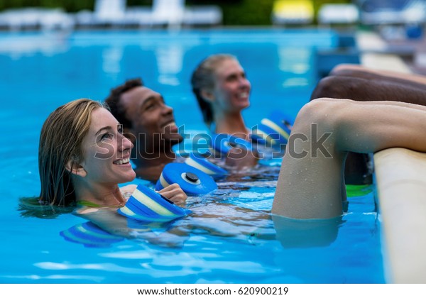 Group Following Instructor During Aqua Fitness Stock Photo Edit Now