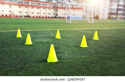 Group of football training cones on the soccer field - Powered by Shutterstock