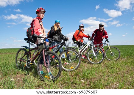 Similar – Image, Stock Photo 4 sporty cyclists on a bridge