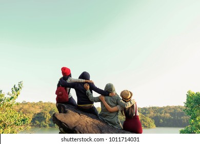 Group Of Four Best Friends Laughing And Having A Good Time While Hiking In Wild Forest, Beauty Of Nature. Relax Time On Holiday Concept Travel, Thailand.