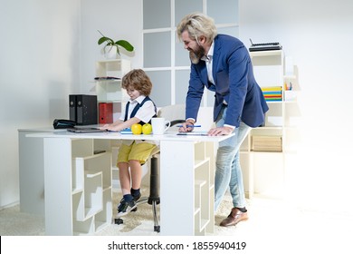 Group Of Four Business Colleagues In Suits Working On Project. Cute Boy Kid Sitting In Office Chair Self Confident Like Big Boss, Funny Businessman Bossy Child, Director And Leader Humorous Concept