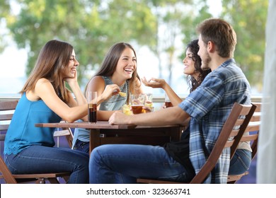 Group of four friends talking and drinking sitting in a terrace at home - Powered by Shutterstock