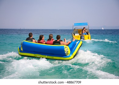 Group of four getting ready for bouncing fun on Croatian coast