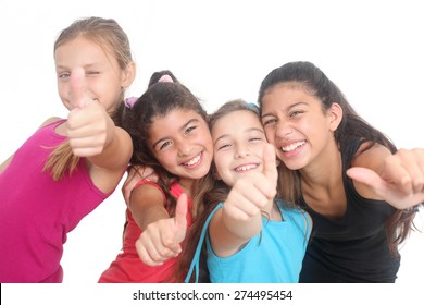 group of four happy kids showing thumbs up on a white background