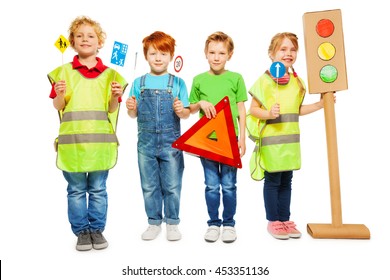 Group Of Four Kids Studying Road Safety Rules