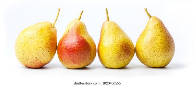 A group of four whole fresh red pears isolated on a white background. Big plan.