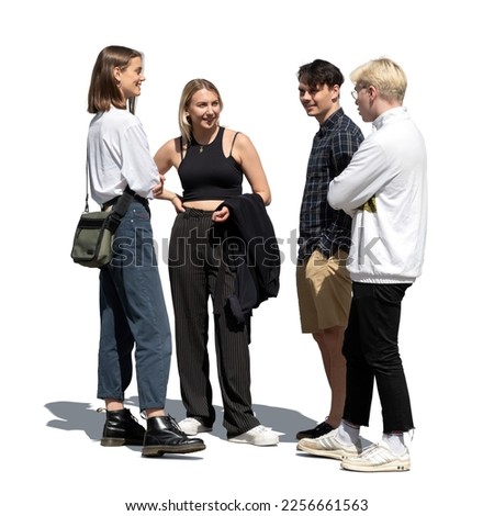 Group of four young friends standing together and talking isolated on white background