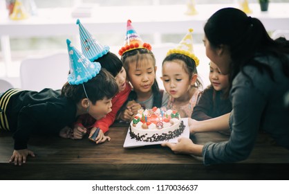 Group Of Friend Kid Asian Event Meeting Birthday Party. Child Enjoying With Cake .