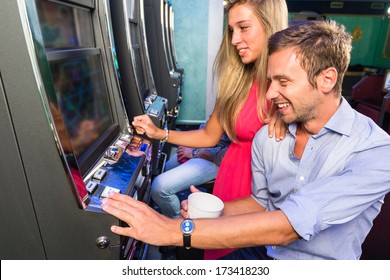 Group Of Friend Playing With Slot Machines