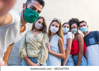 Group Friend Wearing Face Mask For Covid – Young People Using Mobile Phone Wearing Surgical Mask – Teenagers Hangout Using Smart Phone 