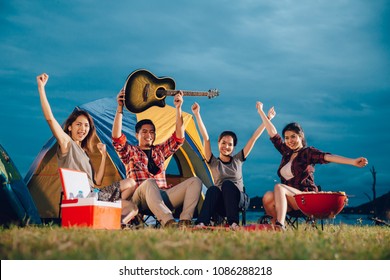 Group of Friends Asian Camp Forest Adventure Travel Remote Relax Concept, mountain view. Dinner party, Camping barbecue and drink beer.
 - Powered by Shutterstock