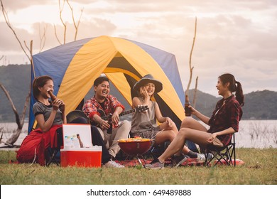 Group Of Friends Asian Camp Forest Adventure Travel Remote Relax Concept,
Mountain View. Dinner Party, Camping Barbecue And Drink Beer.