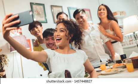 Group Friends Asian Are Taking Selfies While Eating Dinner.