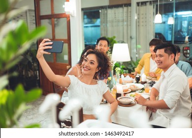 Group Friends Asian Are Taking Selfies While Eating Dinner.