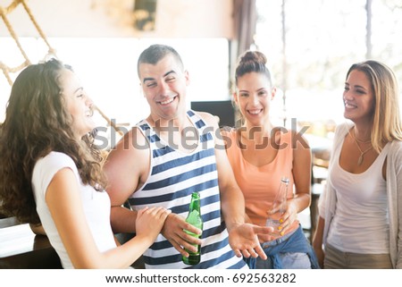 Similar – Image, Stock Photo Group of young people having fun in summer party