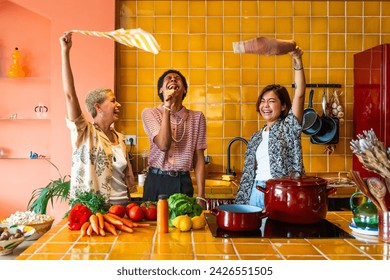 Group of friends bonding at home, LGBTQ and diversity concepts - Homosexual couple and fluid gender non binary man with cross dressing clothing style having fun in the apartment, LGBT people concepts - Powered by Shutterstock