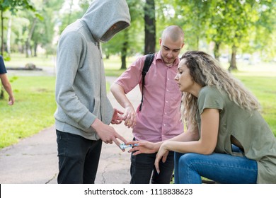 Group of friends buying drugs from their local drug dealer
