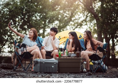 Group Of Friends At Campground, Camping Tent With Friends, Diverse Asian Young Family Hangout Together At Camp Yard. Outdoor Activity And Leisure On Holiday.