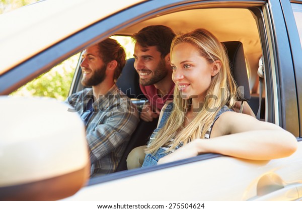 Group Of Friends
In Car On Road Trip
Together