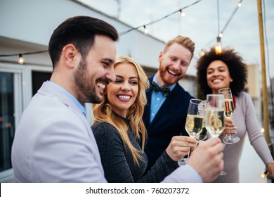 Group Of Friends Celebrating With Champagne