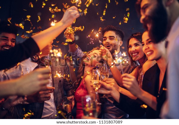 Group Of Friends Celebrating At A Nightclub