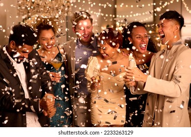 Group Of Friends Celebrating At Party Together With Drinks And Confetti - Powered by Shutterstock