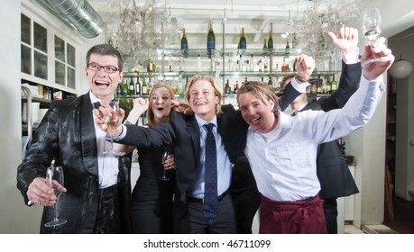 Group Of Friends Cheering In A Restaurant Bar