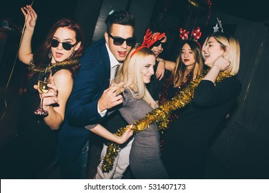 Group of friends at club having fun. New year's party